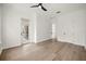 Spacious bedroom with hardwood flooring, ceiling fan, private balcony and a light and airy feel at 1316 Lake Baldwin Ln, Orlando, FL 32814