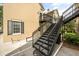 View of the townhome exterior featuring black iron stairs leading to the upper level at 1316 Lake Baldwin Ln, Orlando, FL 32814