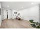 Spacious office area with hardwood flooring, modern lighting, and white wall paneling at 1316 Lake Baldwin Ln, Orlando, FL 32814