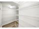 Spacious walk-in pantry with custom shelving and lighting at 1316 Lake Baldwin Ln, Orlando, FL 32814