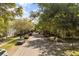 A tree-lined street view with cars parked along the sides and sidewalks at 1316 Lake Baldwin Ln, Orlando, FL 32814