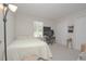 Neutral bedroom features a work area, window with bright light, and double door closet at 14433 Huntingfield Dr, Orlando, FL 32824