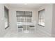 Cozy breakfast nook with views of the pool, complemented by stylish lighting and decor at 14433 Huntingfield Dr, Orlando, FL 32824