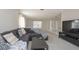 Cozy living room with comfortable seating, large windows and a seamless flow at 14433 Huntingfield Dr, Orlando, FL 32824