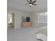 Bright main bedroom with ceiling fan, adjacent bathroom, and ample space at 14433 Huntingfield Dr, Orlando, FL 32824