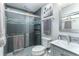Modern bathroom featuring a glass shower with decorative tile and gray walls at 1448 Lambert St, Deltona, FL 32725