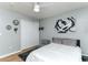 Bright bedroom with modern decor, white walls, and hardwood floors at 1448 Lambert St, Deltona, FL 32725