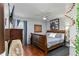 Cozy bedroom with a comfortable bed, warm wood floors, and natural light at 1448 Lambert St, Deltona, FL 32725