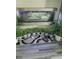 Stylish indoor water feature with multiple plants on a gray rug at 1448 Lambert St, Deltona, FL 32725