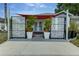 Inviting front entrance with decorative screens, potted plants, and a covered walkway to the front door at 1448 Lambert St, Deltona, FL 32725
