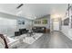 Inviting living room featuring gray walls, modern decor, and plenty of natural light at 1448 Lambert St, Deltona, FL 32725