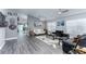 Spacious living room with neutral walls, wood-look floors, and comfortable seating areas at 1448 Lambert St, Deltona, FL 32725