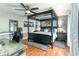 Elegant main bedroom featuring a canopy bed, modern furnishings, and warm wood floors at 1448 Lambert St, Deltona, FL 32725