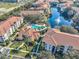 Aerial view of a condominium community featuring a pool, waterways, and well-maintained landscaping at 1475 Lake Shadow Cir # 6205, Maitland, FL 32751