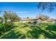 A sprawling backyard offers ample green space, mature landscaping, and a peaceful setting at 1624 Bel Air Ave, Orlando, FL 32812