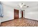 Bedroom boasts hardwood floors, ceiling fan, closet, and neutral colors, a blank canvas ready for personalization at 1624 Bel Air Ave, Orlando, FL 32812