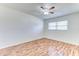 Bright bedroom with hardwood floors and a ceiling fan; natural light from the window at 1624 Bel Air Ave, Orlando, FL 32812