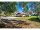 Charming home featuring a spacious driveway, well-maintained lawn, and inviting curb appeal at 1624 Bel Air Ave, Orlando, FL 32812