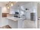 Modern kitchen features stainless steel appliances, white cabinetry, and a center island at 1624 Bel Air Ave, Orlando, FL 32812
