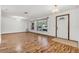 Bright and airy living room featuring wood floors and lots of natural light at 1624 Bel Air Ave, Orlando, FL 32812