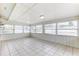 Bright sunroom with tile flooring and large windows, perfect for relaxation at 1624 Bel Air Ave, Orlando, FL 32812