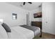 Comfortable bedroom with carpet, a ceiling fan, and a TV mounted above a dresser at 1644 Tropical Palms Cir, Kissimmee, FL 34747