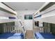 Bedroom featuring two wooden bunk beds with access to other rooms and a mounted TV at 1644 Tropical Palms Cir, Kissimmee, FL 34747