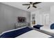 Bedroom with twin beds, a TV, and a connecting bathroom at 1644 Tropical Palms Cir, Kissimmee, FL 34747