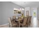 Charming dining room features a decorative chandelier and large dining table, perfect for gatherings at 1644 Tropical Palms Cir, Kissimmee, FL 34747