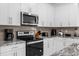 Well-appointed kitchen featuring modern appliances, ample cabinet space, and stylish countertops at 1644 Tropical Palms Cir, Kissimmee, FL 34747