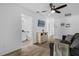 Casual living room with neutral carpet, access to the bath, and other rooms at 1644 Tropical Palms Cir, Kissimmee, FL 34747
