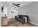 Casual living room featuring neutral carpet, a gray sofa and decor at 1644 Tropical Palms Cir, Kissimmee, FL 34747