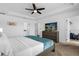 Comfortable main bedroom with a ceiling fan, and a mounted TV atop a wooden dresser at 1644 Tropical Palms Cir, Kissimmee, FL 34747