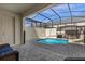 Enclosed pool area with brick pavers and screen, offering a private outdoor retreat at 1644 Tropical Palms Cir, Kissimmee, FL 34747