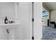 Powder room with pedestal sink and open access to patio at 1644 Tropical Palms Cir, Kissimmee, FL 34747