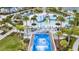 Aerial view of a water park featuring slides, palm trees, and various aquatic activities at 1644 Tropical Palms Cir, Kissimmee, FL 34747