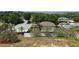 View of backyard and other homes in the community at 2018 Knollcrest Dr, Clermont, FL 34711