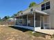 Backyard features a screened lanai, providing a great space for relaxation and entertaining at 2018 Knollcrest Dr, Clermont, FL 34711
