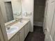 Double sink bathroom vanity with a door leading to the bath and toilet at 2018 Knollcrest Dr, Clermont, FL 34711