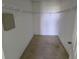 Walk-in closet with carpet and rack shelving for optimal storage at 2018 Knollcrest Dr, Clermont, FL 34711