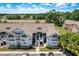 Inviting light blue condominium complex with arched windows and well-maintained landscaping at 2028 Royal Bay Blvd # 85, Kissimmee, FL 34746