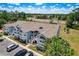Beautiful blue condo building featuring multiple floors, balconies, and well-maintained landscaping in a community setting at 2028 Royal Bay Blvd # 85, Kissimmee, FL 34746