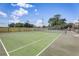 Well-maintained community tennis court with green surface, net, and surrounding fence, perfect for recreation at 2028 Royal Bay Blvd # 85, Kissimmee, FL 34746