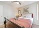 Relaxing bedroom with a queen bed, ceiling fan, and soft lighting at 2047 Royal Bay Blvd # 21, Kissimmee, FL 34746