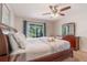 Bedroom with a king bed, slider to backyard and dresser at 2047 Royal Bay Blvd # 21, Kissimmee, FL 34746