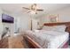 Bedroom featuring a ceiling fan, TV, and access to the bathroom and closet at 2047 Royal Bay Blvd # 21, Kissimmee, FL 34746