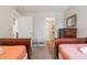 Bedroom with twin beds, dresser, and carpet flooring at 2047 Royal Bay Blvd # 21, Kissimmee, FL 34746