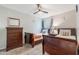 Bedroom featuring twin beds, dresser, and window with natural light at 2047 Royal Bay Blvd # 21, Kissimmee, FL 34746