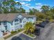 Exterior aerial view of condos with an ample parking lot and beautiful landscaping at 2047 Royal Bay Blvd # 21, Kissimmee, FL 34746