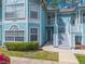 Inviting two-story condo featuring a private entrance and landscaped front yard at 2047 Royal Bay Blvd # 21, Kissimmee, FL 34746